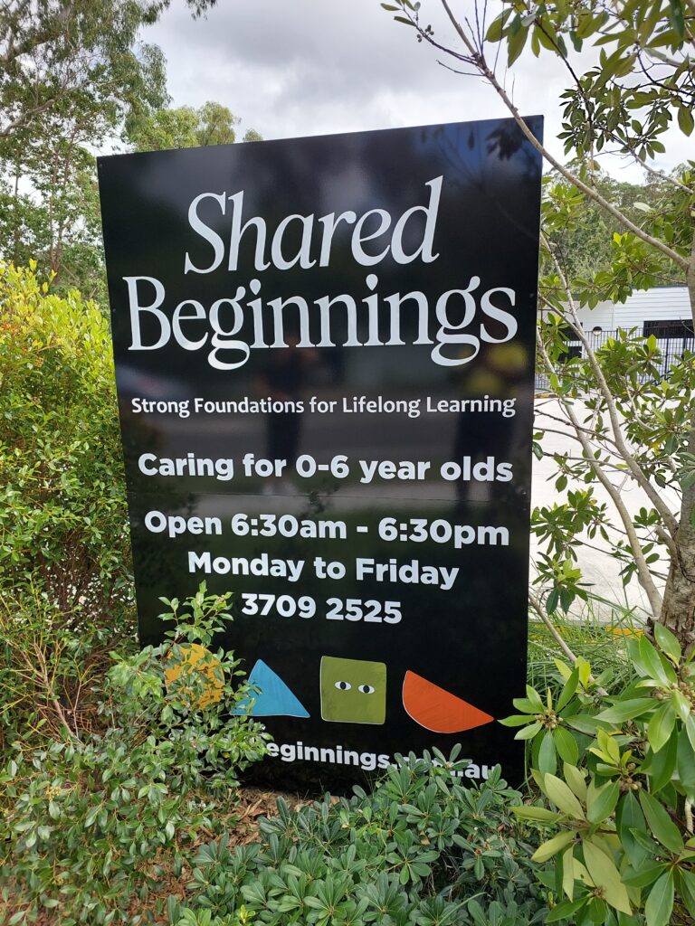 Shared Beginnings roadside branding sign with tagline and website